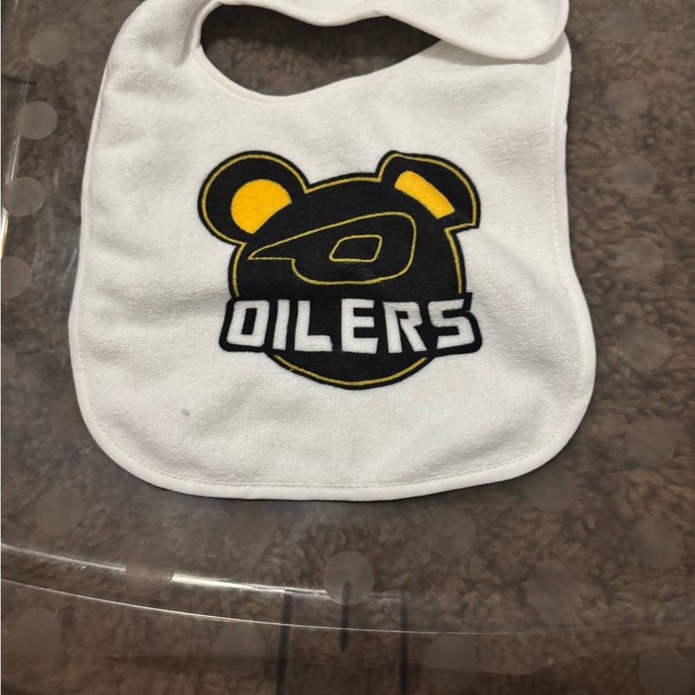White Baby Bib with Black and Yellow Logo